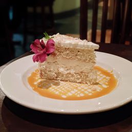 Wild Sage Bistro signature dishes Popovers (served with lavender honey butter), Yukon Taquitos, Pork Tenderloin Au Poivre, Pacific Chinook Salmon, and the signature Soon to Be Famous Coconut Cream Layer Cake.
